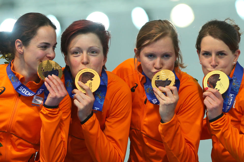 SOCHI, RUSSIA - FEBRUARY 22:  Gold medalists Netherlands celebrate during the medal ceremony for the Speed Skating Women's Pursuit on day fifteen of the Sochi 2014 Winter Olympics at  at Adler Arena Skating Center on February 22, 2014 in Sochi, Russia.  (Photo by Quinn Rooney/Getty Images)