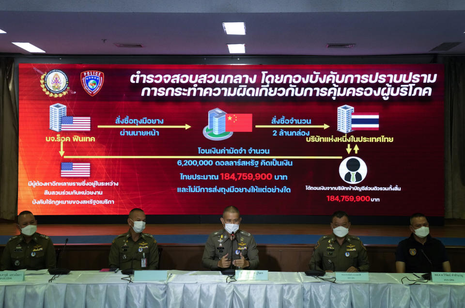 Commissioner of Central Investigation Bureau Jirabhob Bhuridej holds a press conference in Bangkok, Thailand, Wednesday, Nov. 3, 2021. The commissioner announced that they have arrested the head of a company suspected of cheating overseas buyers of medical rubber gloves during the coronavirus pandemic. (AP Photo/Sakchai Lalit)