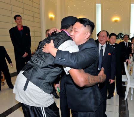 North Korean leader Kim Jong-Un and former NBA basketball player Dennis Rodman (front L) hug in Pyongyang in this undated picture released by North Korea's KCNA news agency on March 1, 2013. REUTERS/KCNA/Files