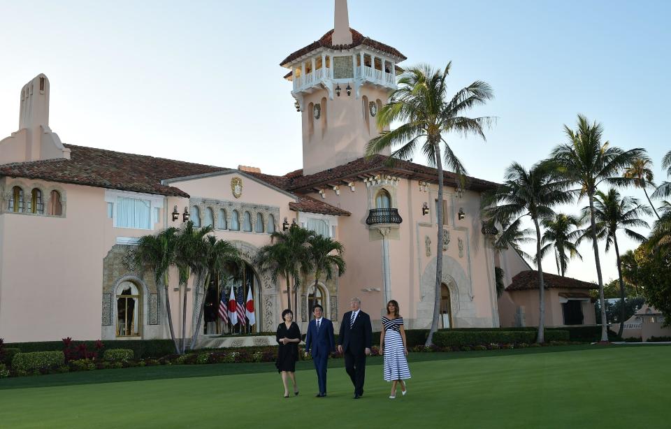 President Donald Trump and First Lady Melania Trump greet Japan's Prime Minister Shinzo Abe and wife Akie Abe as they arrive for dinner at Trump's Mar-a-Lago resort in Palm Beach, Florida on April 17, 2018. / Credit: MANDEL NGAN/AFP via Getty Images