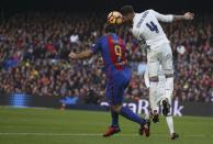 Football Soccer - Barcelona v Real Madrid - Spanish La Liga Santander- Nou Camp Stadium, Barcelona, Spain - 3/12/16. Real Madrid's Sergio Ramos and Barcelona's Luis Suarez in action during the "Clasico". REUTERS/Sergio Perez