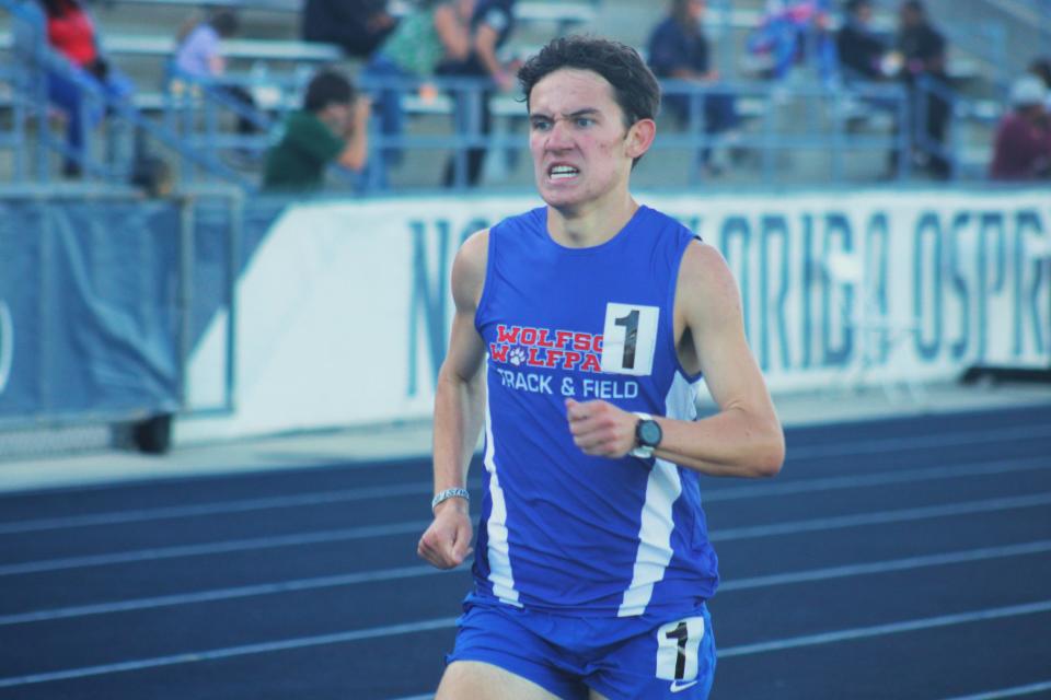 Wolfson's Andrew Marello presses on toward the finish line to win the boys 1,600-meter run in the Gateway Conference high school track and field meet at the University of North Florida's Hodges Stadium on April 5, 2024. [Clayton Freeman/Florida Times-Union]