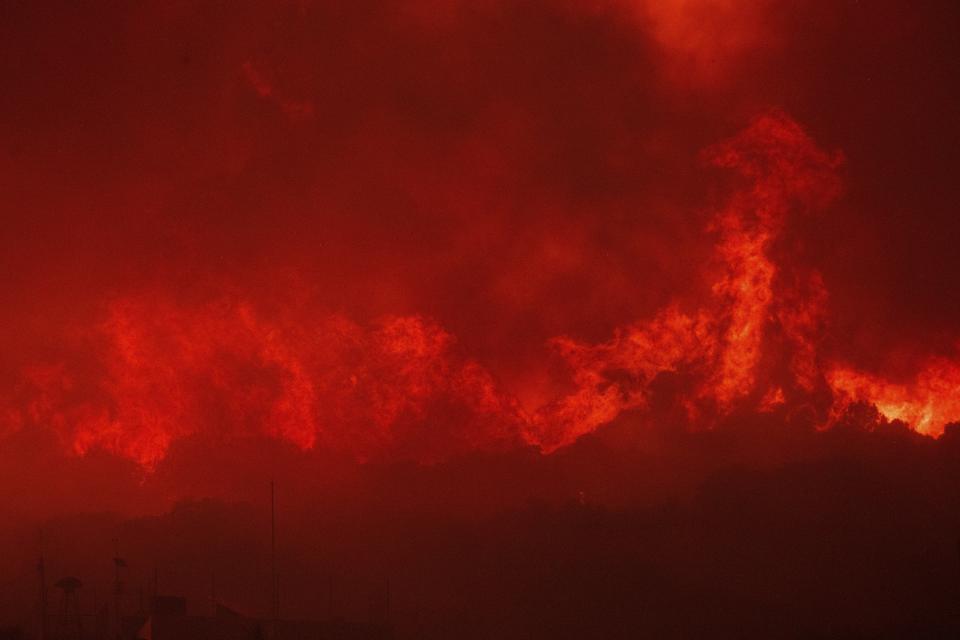 Flames burn a forest during a wildfire in Avantas village, near Alexandroupolis town, in the northeastern Evros region, Greece, Monday, Aug. 21, 2023. (AP Photo/Achilleas Chiras)