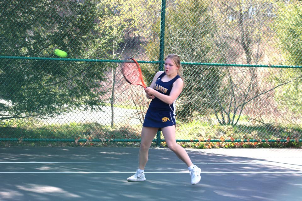 Third singles player Carlee Rich from Quabbin returns the ball in a match in Littleton on April 24, 2024.