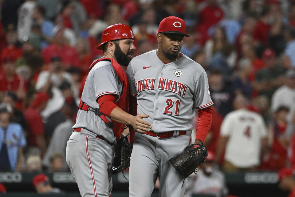 Cincinnati Reds catcher Austin Romine, left, and teammate Alexis Diaz (21) celebrate their victory over the St. Louis Cardinals in a baseball game on Thursday, Sept. 15, 2022, in St. Louis. (AP Photo/Joe Puetz)
