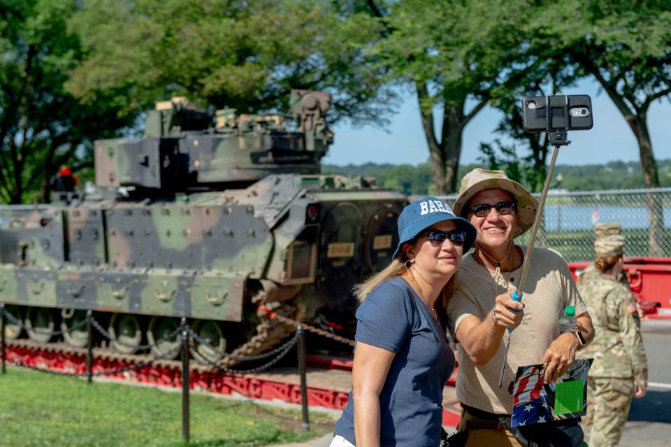Marcia Fuentes De Arroba, and Ivan Arroba take a selfie with a Bradley Fighting Vehicles parked near the Lincoln Memorial in the background on July 3, 2019. Ivan is a United States Navy retiree and the couple is visiting Washington D.C. from Ecuador to celebrate their anniversary. The vehicle is here for Thursdays July Fourth Salute to America celebration.
