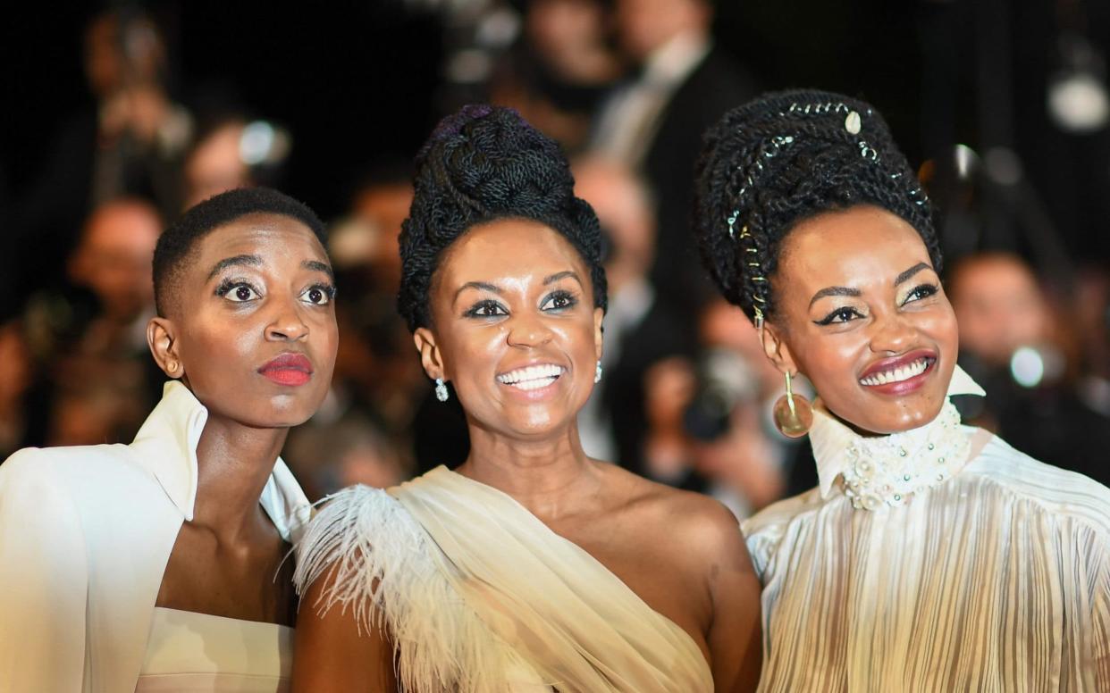 Kenyan director Wanuri Kahiu (centre), with  actresses Samantha Mugatsia (left) and Sheila Munyiva (right) at the Cannes premiere of their film Rafiki - AFP