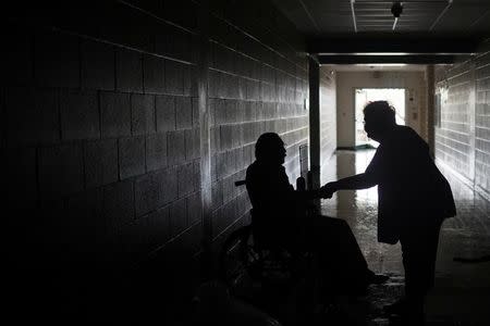 FILE PHOTO: Residents, who lost their homes to Hurricane Harvey, say good bye as they prepare to relocate from the safety of a school in Rockport, Texas, U.S. August 26, 2017. REUTERS/Adrees Latif /File Photo