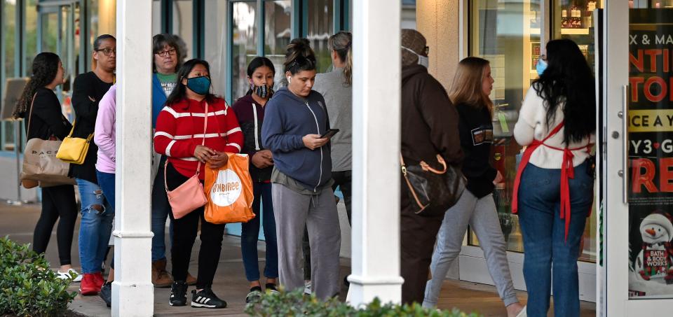 Black Friday's early morning shoppers line up at the Bath & Body Works at Ellenton's Premium Outlets in Ellenton.