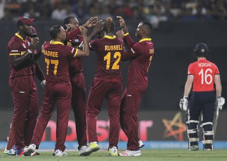 Cricket - England v West Indies - World Twenty20 cricket tournament final - Kolkata, India - 03/04/2016. West Indies players celebrate the dismissal of England's captain Eoin Morgan. REUTERS/Rupak De Chowdhuri