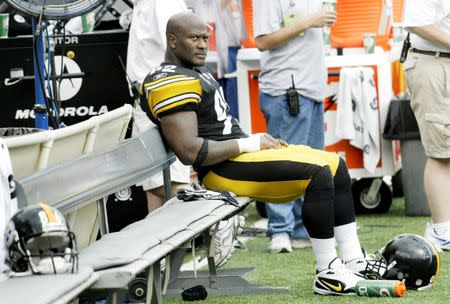 Pittsburgh Steelers linebacker James Harrison sits alone on the bench on the sidelines during the closing minutes of the Steelers NFL football game against the Baltimore Ravens in Baltimore, Maryland September 11, 2011. REUTERS/Joe Giza