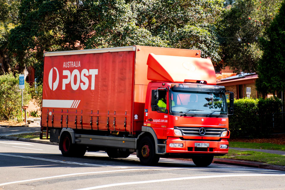 Australia Post truck driving on a street. Source: Getty Images