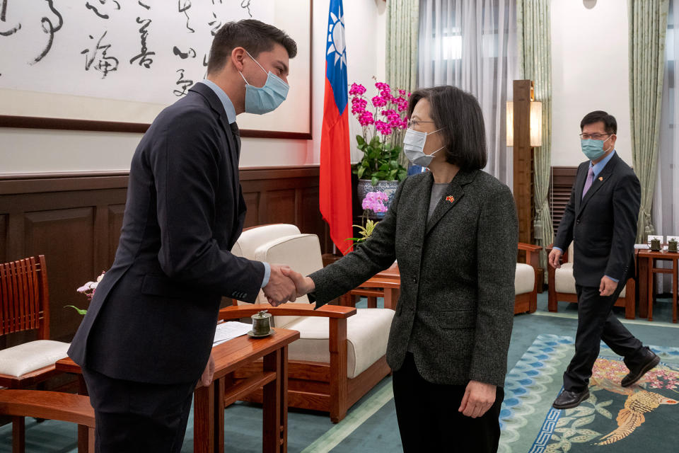 FILE - In this photo released by the Taiwan Presidential Office, Taiwan's President Tsai Ing-wen, right, shakes hands with Fabian Molina, a member of Swiss National Council, during a meeting in Taipei, Taiwan, Monday, Feb. 6, 2023. Switzerland’s lower house of parliament has voted to tighten ties with the legislature in Taiwan, a move that could further rankle China after recent visits by Western lawmakers to the island. (Taiwan Presidential Office via AP, File)