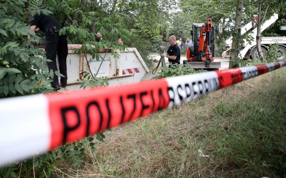 German police officers dig up and search a garden plot in Hannover, northern Germany, as part of the investigation into Madeleine McCann's disappearance - Friedemann Vogel/EPA-EFE/Shutterstock