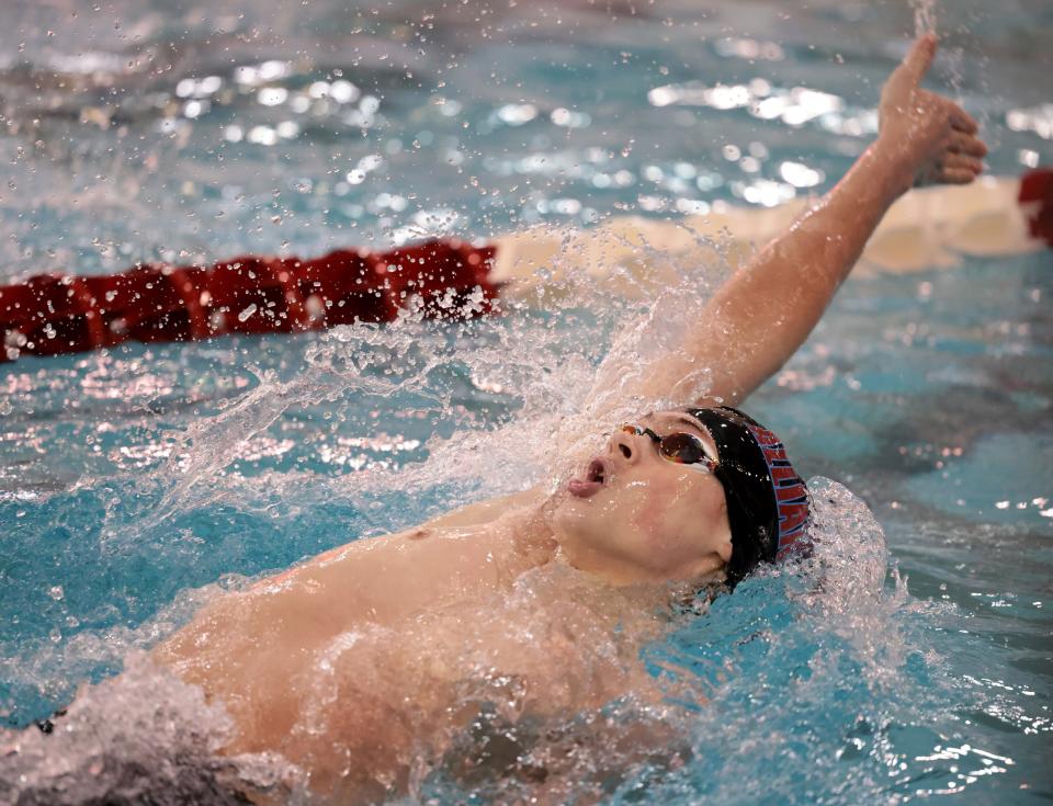 Alliance’s Ben Craig competes in the 100 yard backstroke at the OHSAA Div. II State Swimming prelims held at Branin Natatorium in Canton Ohio, Thursday, Feb. 23, 2023.