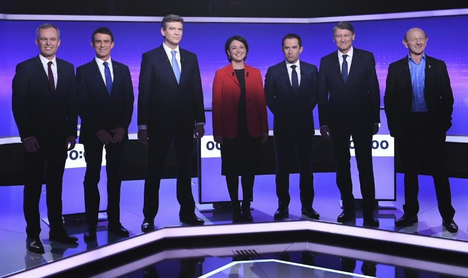 Candidates for the French left's presidential primaries ahead of the 2017 presidential election, (from L) Francois de Rugy, Manuel Valls, Arnaud Montebourg, Sylvia Pinel, Benoit Hamon, Vincent Peillon, Jean-Luc Bennahmias pose before taking part in a final televised debate in Paris, France, Thursday, Jan. 19, 2017. Seven competitors are bidding to be the Socialist Party's candidate in next spring's French presidential election. (Eric Feferberg/Pool Photo via AP)
