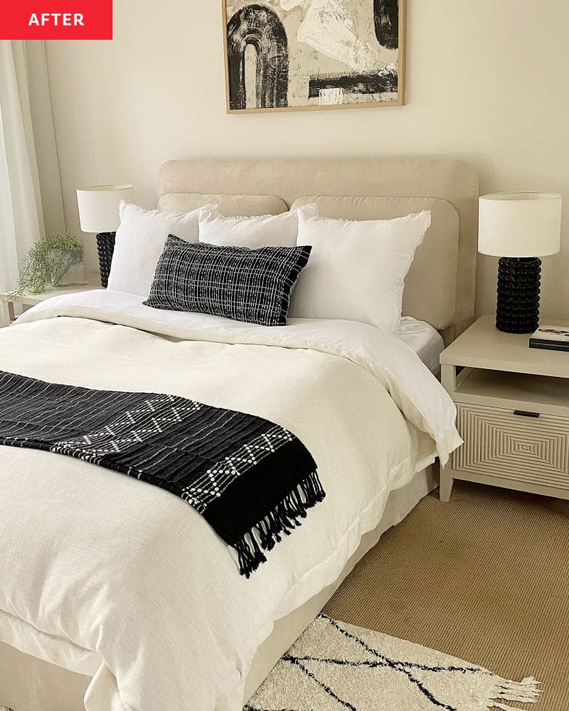 Neutral colored bedroom after renovation with a plush textile headboard and white bed textiles.