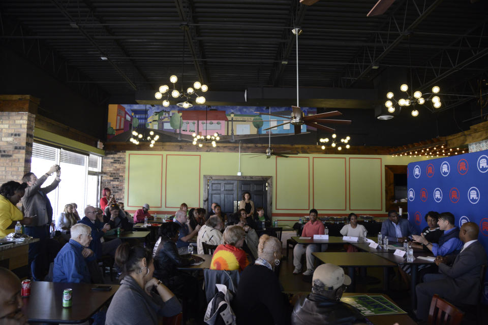 Jennifer-Ruth Green, the Republican candidate for Indiana's 1st Congressional District and an U.S. Air Force veteran listens as Sen. Todd Young, R-Ind., speaks during a roundtable meeting with Utah Rep. Burgess Owens along with business owners Thursday, Oct. 20, 2022, in Gary, Ind. (AP Photo/Paul Beaty)