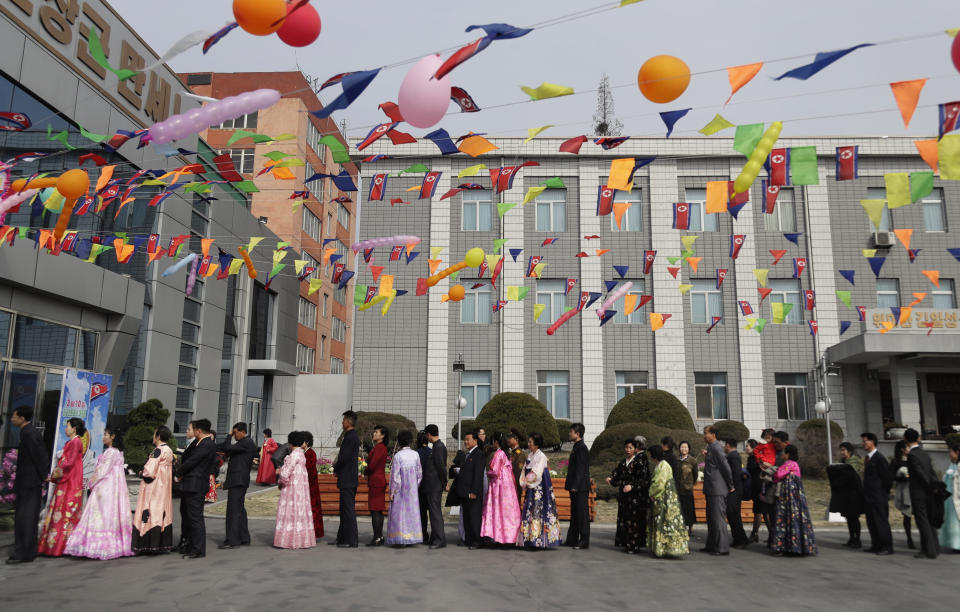 People line up to vote during the election at a polling station in Pyongyang, North Korea, Sunday, March 10, 2019. Millions of North Korean voters, including leader Kim Jong Un, are going to the polls to elect roughly 700 members to the national legislature. In typical North Korean style, voters are presented with just one state-sanctioned candidate per district and they cast ballots to show their approval or, very rarely, disapproval. (AP Photo/Dita Alangkara)