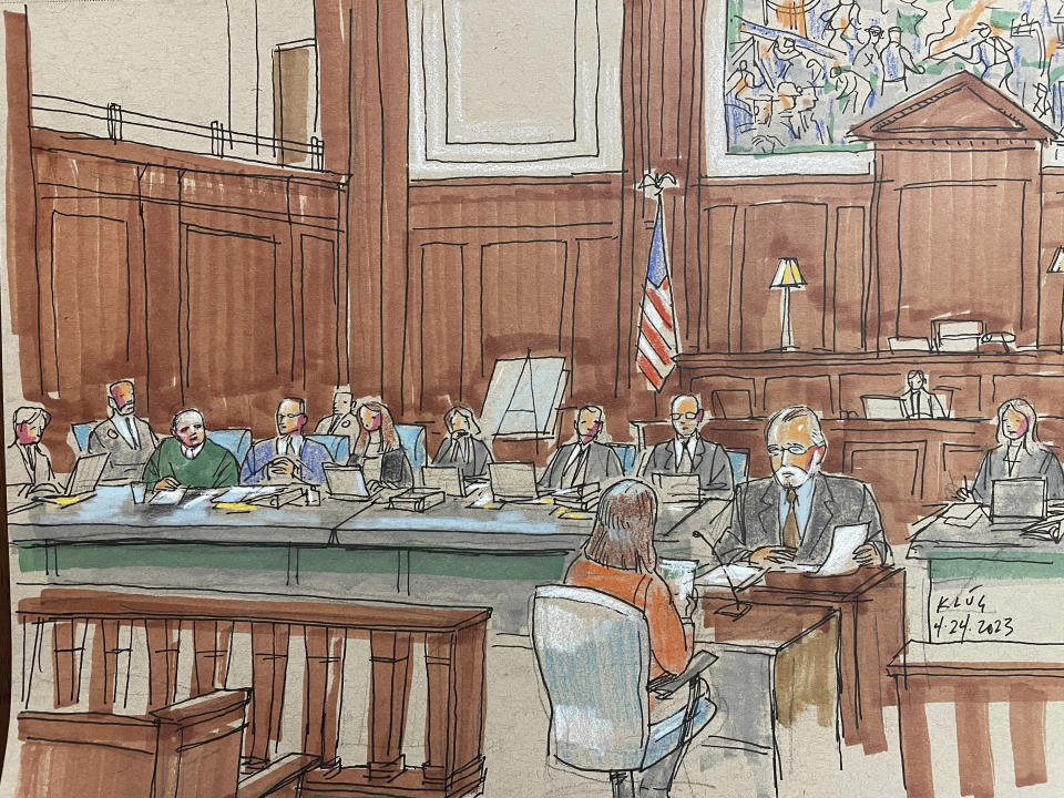 CORRECTS TO THIRD FROM LEFT NOT SECOND Robert Bowers, third from left, sits with his lawyers and takes notes during jury selection for trial in his potential death penalty case on Monday, April 24, 2023, in federal court in Pittsburgh. Bowers, who pleaded not guilty, is charged in the 2018 shooting that killed 11 worshippers at the Tree of Life synagogue, the deadliest antisemitic attack in U.S. history. (AP Photo/Dave Klug)