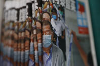 Copies of Apple Daily newspaper with front pages featuring Hong Kong media tycoon Jimmy Lai, are displayed for sale at a newsstand in Hong Kong Tuesday, Aug. 11, 2020. A year ago, the pro-democracy Apple Daily newspaper published a front-page headline saying Hong Kong's governing principle of “one country, two systems is dead." On Thursday, June 17, 2021, the newspaper was facing its greatest peril. Three top editors and two senior executives were arrested under Hong Kong's new national security law. (AP Photo/Kin Cheung, File)