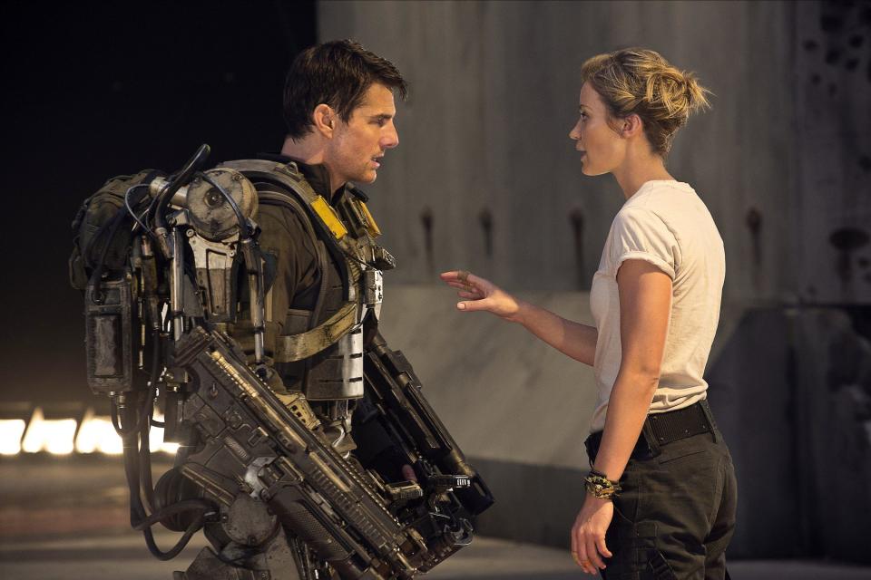 A man in a mech suit gets some tough love from his female mentor in “Edge of Tomorrow”