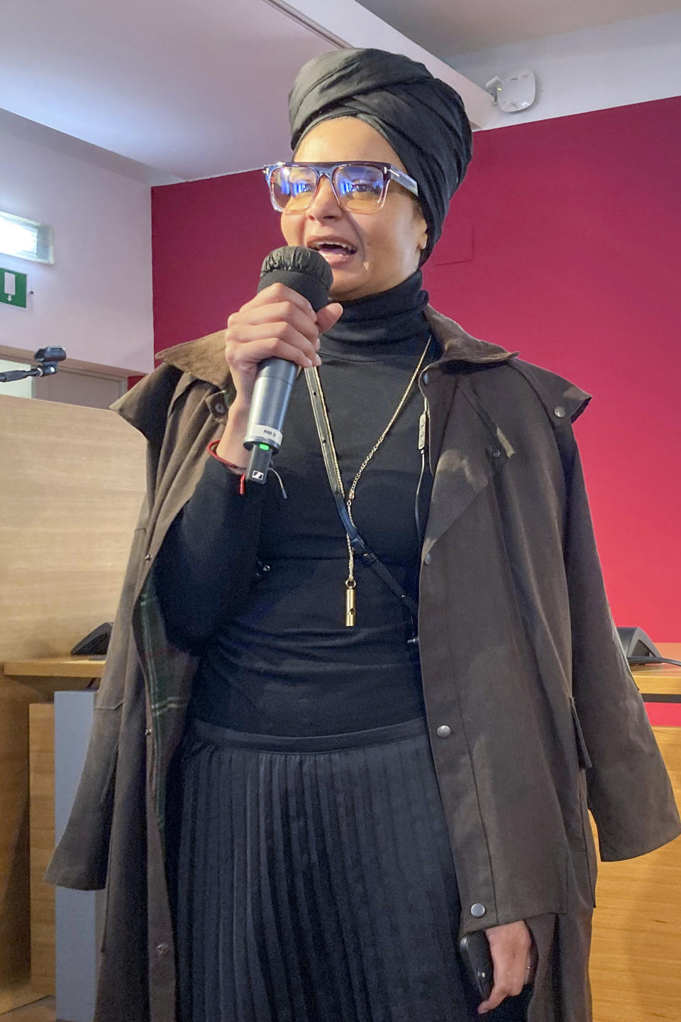 Fashion designer Stella Jean speaks at a press conference in Milan, northern Italy, Wednesday, Feb. 8, 2023. The only Black designer belonging to Italy's fashion council is withdrawing from this month's Milan Fashion Week citing a lack of commitment to diversity and inclusion. (AP Photo/Colleen Barry)