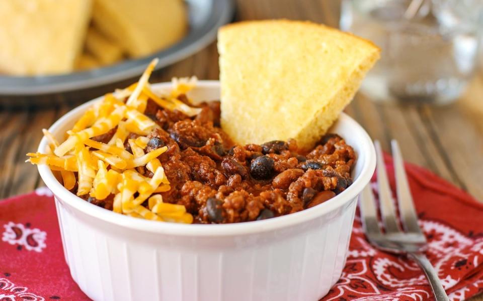 <p>Chad A Elick</p><p>Three bean varieties, <a href="https://www.yahoo.com/lifestyle/150-ground-beef-recipes-dinner-133027676.html" data-ylk="slk:ground beef;elm:context_link;itc:0;sec:content-canvas;outcm:mb_qualified_link;_E:mb_qualified_link;ct:story;" class="link  yahoo-link">ground beef</a>, Chorizo, and chipotle peppers give this real southwestern flavor with a little kick.</p><p><strong>Get the recipe: <a href="https://parade.com/26582/donnaelick/cowboy-chili/" rel="nofollow noopener" target="_blank" data-ylk="slk:25-Minute Quick-Draw Cowboy Chili;elm:context_link;itc:0;sec:content-canvas" class="link ">25-Minute Quick-Draw Cowboy Chili</a></strong></p>