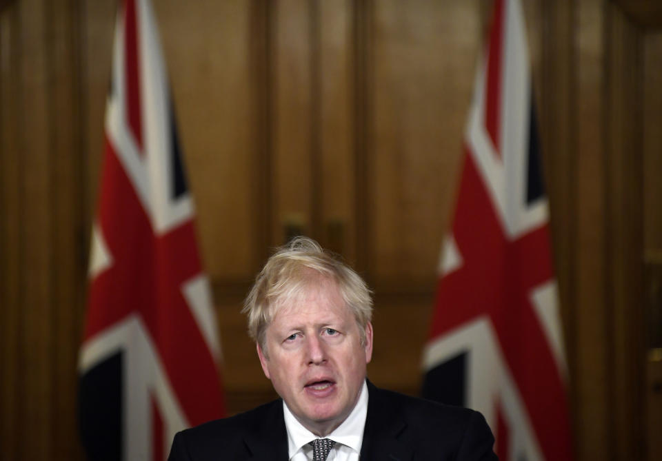 Britain's Prime Minister Boris Johnson speaks during a press conference in 10 Downing Street, London, Saturday, Oct. 31, 2020 where he announced new restrictions to help combat a coronavirus surge. (AP Photo/Alberto Pezzali, Pool)