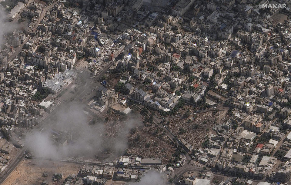 This image provided by Maxar Technologies on Wednesday, Oct. 18, 2023, shows an overview of the al-Ahli Hospital, center of image, in Gaza City after a deadly explosion. (Satellite image ©2023 Maxar Technologies via AP)