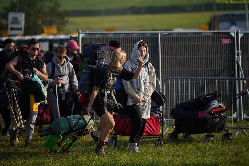 People arrive for the Glastonbury Festival at Worthy Farm in Somerset. Picture date: Wednesday June 26, 2024.