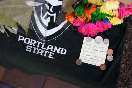 Flowers and a note from a makeshift memorial for Deante Strickland sit outside the Peter W. Stott Center in Portland