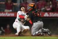 Los Angeles Angels designated hitter Shohei Ohtani (17) slides in to home to score ahead of a tag by Baltimore Orioles catcher Pedro Severino (28) during the ninth inning of a baseball game Friday, July 2, 2021, in Anaheim, Calif. The run won the game for the Angels 8-7. (AP Photo/Ashley Landis)