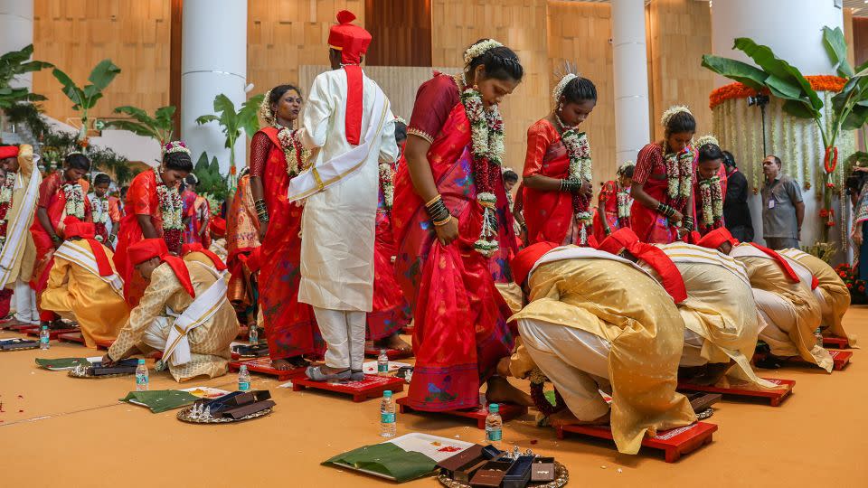 Brides and grooms perform rituals during a mass wedding ceremony for underprivileged couples hosted by Anant Ambani's parents, Nita and Mukesh. - Divyakant Solanki/EPA-EFE/Shutterstock