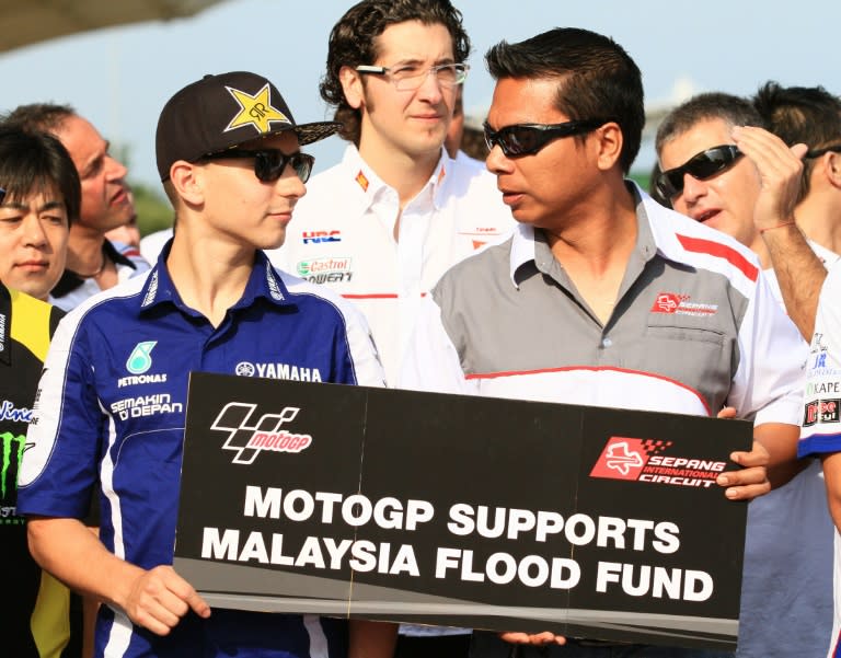 Sepang Intenational Circuit chief executive Razlan Razali (R) says MotoGP Malaysia Grand Prix has consistently seen strong ticket sales