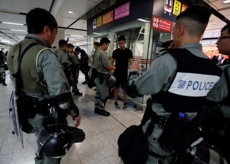 Police patrol at a MTR station as they keep a lookout for protesters in Hong Kong