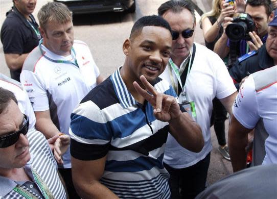 <b>9. Will Smith, $624 million</b> <br>Will Smith flashes the victory sign as he arrives in the paddocks during the Monaco F1 Grand Prix May 27, 2012.