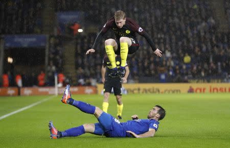 Football Soccer Britain - Leicester City v Manchester City - Premier League - King Power Stadium - 10/12/16 Manchester City's Kevin De Bruyne jumps over the tackle from Leicester City's Christian Fuchs Reuters / Darren Staples Livepic