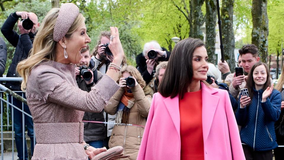 Queen Letizia and Queen Maxima waving