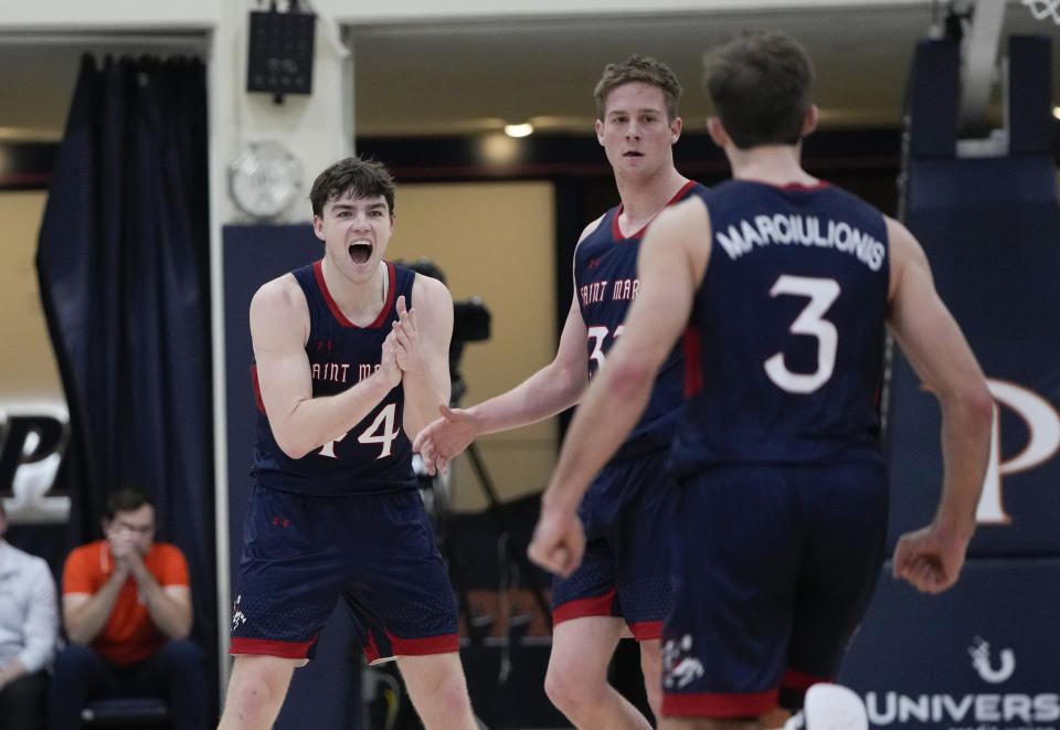 Saint Mary's guards Alex Ducas, Luke Barrett, and Augustas Marciulionis, from left, react during the first half of the team's NCAA college basketball game against Pepperdine on Thursday, Feb. 29, 2024, in Malibu, Calif. (AP Photo/Ryan Sun)