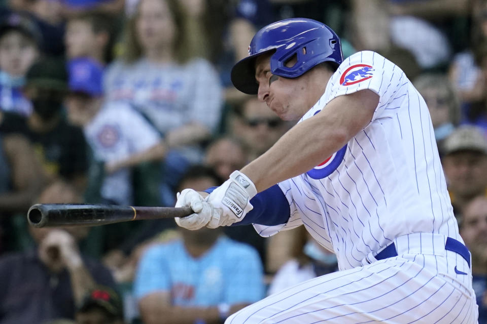 Chicago Cubs' Frank Schwindel hits a grand slam during the seventh inning of a baseball game against the Pittsburgh Pirates in Chicago, Sunday, Sept. 5, 2021. (AP Photo/Nam Y. Huh)