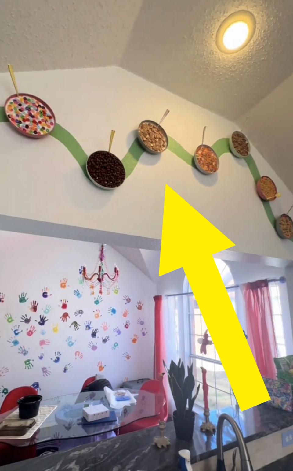 A closer shot of the cereal wall, featuring the fake bowls of cereal arranged in a wavy pattern on the wall as an art piece