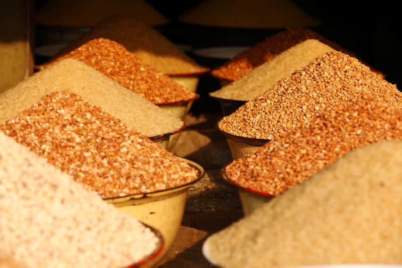 Grains of rice and beans are seen on display for sale at a traditional market in Bariga district, in Lagos