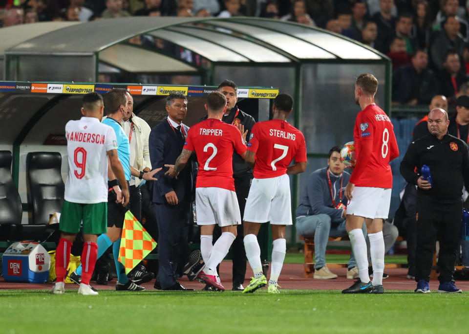 SOFIA, BULGARIA - OCTOBER 14: Raheem Sterling, Kieran Trippier and Jordan Henderson speak with Krasimir Balakov manager of Bulgaria during the UEFA Euro 2020 qualifier between Bulgaria and England on October 14, 2019 in Sofia, Bulgaria. (Photo by Catherine Ivill/Getty Images)