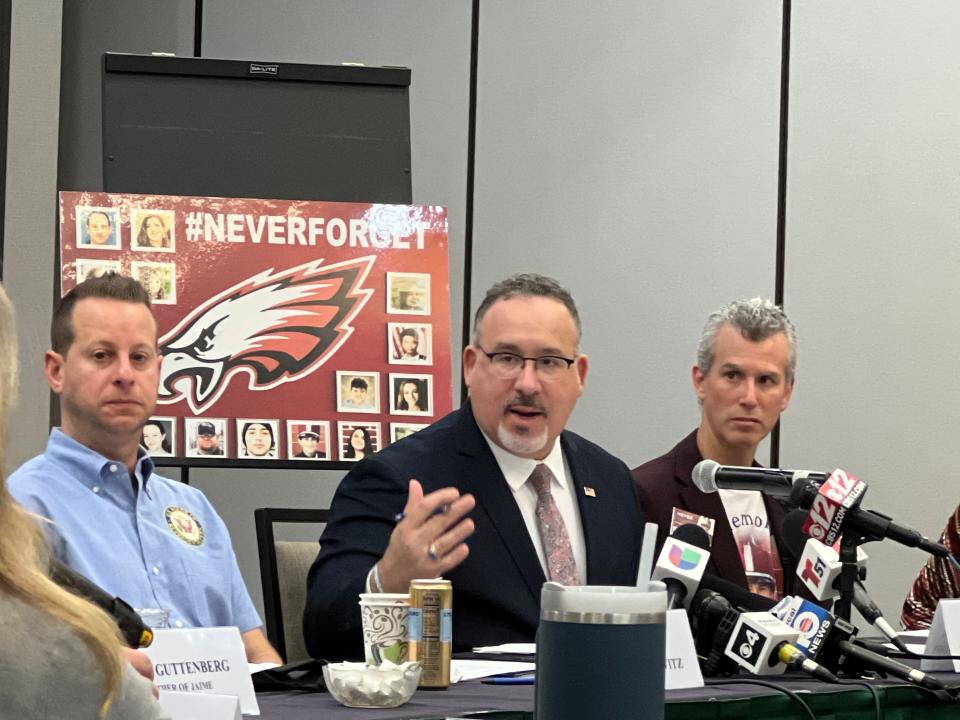 U.S. Secretary of Education Miguel Cardona, center, speaks at a roundtable with U.S. Rep. Jared Moskowitz, left, and Max Schachter, right. Schachter's son, Alex, was killed in the Marjory Stoneman Douglas High shooting.