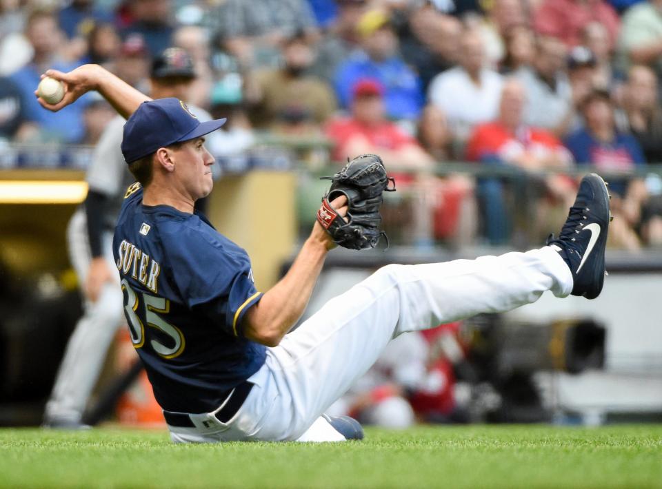 Milwaukee Brewers pitcher Brent Suter completes a double play after catching a bunt by Cleveland Indians pitcher Corey Kluber in the second inning at Miller Park in  Milwaukee.