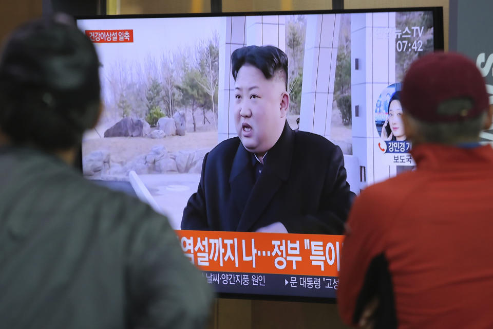 People watch a TV showing a file image of North Korean leader Kim Jong Un during a news program at the Seoul Railway Station in Seoul, South Korea, Saturday, May 2, 2020. Kim made his first public appearance in several weeks as he celebrated the completion of a fertilizer factory near Pyongyang, state media said Saturday, ending an absence that had triggered global rumors that he was seriously ill. (AP Photo/Ahn Young-joon)