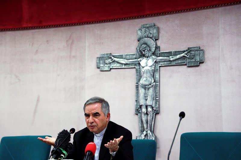 Cardinal Giovanni Angelo Becciu speaks to the media in Rome