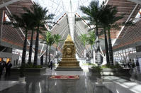 A Bayon carpet statue made of copper is displayed in the Siem Reap-Angkor International Airport in Cambodia as it opened Thursday, Nov. 16, 2023. Cambodia on Thursday officially inaugurated the country's newest and biggest airport, a Chinese-financed project meant to serve as an upgraded gateway to the country’s major tourist attraction, the centuries-old Angkor Wat temple complex in the northwestern province of Siem Reap. (AP Photo/Heng Sinith)