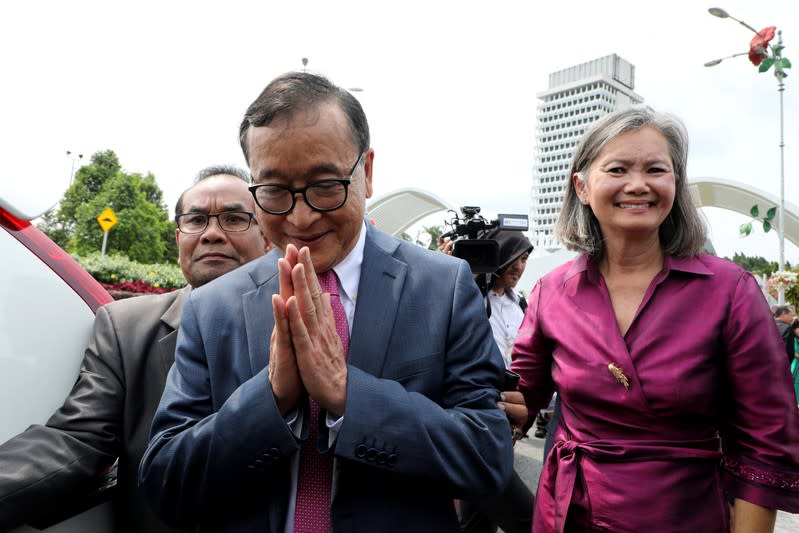 Self-exiled Cambodian opposition party founder Sam Rainsy leaves Parliament House in Kuala Lumpur